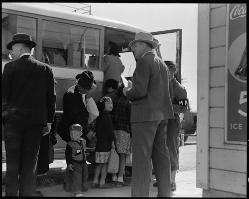  Byron, California. The bus which will take this farm family of Japanese ancestry to the Assembly center is almost ready to leave. Note identification tag on small boy. 
