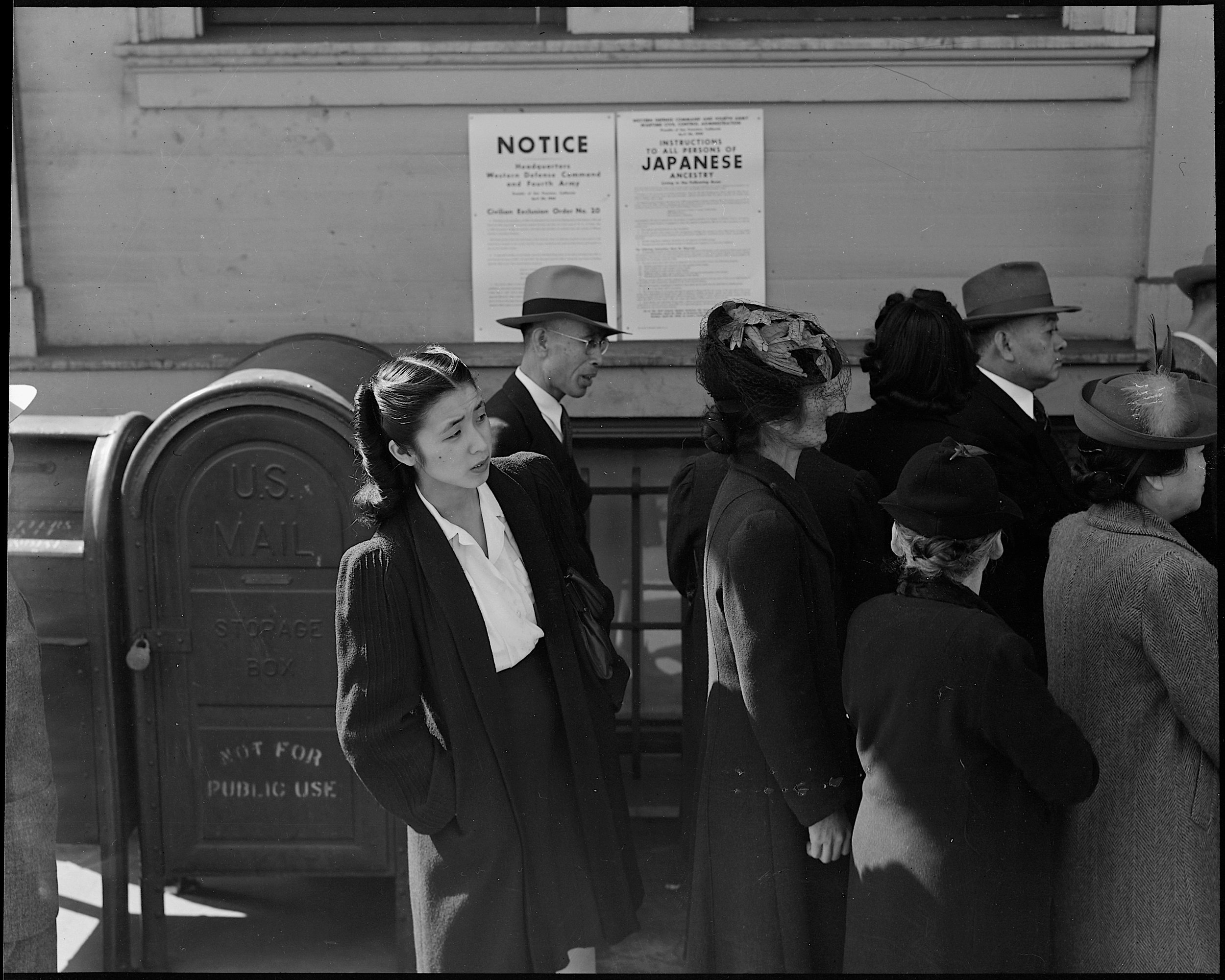 PRINT AVAILABLE April 25, 1942 — San Francisco, California. Residents of Japanese ancestry appear for registration prior to evacuation. Evacuees will be housed in War Relocation Authority centers for the duration.