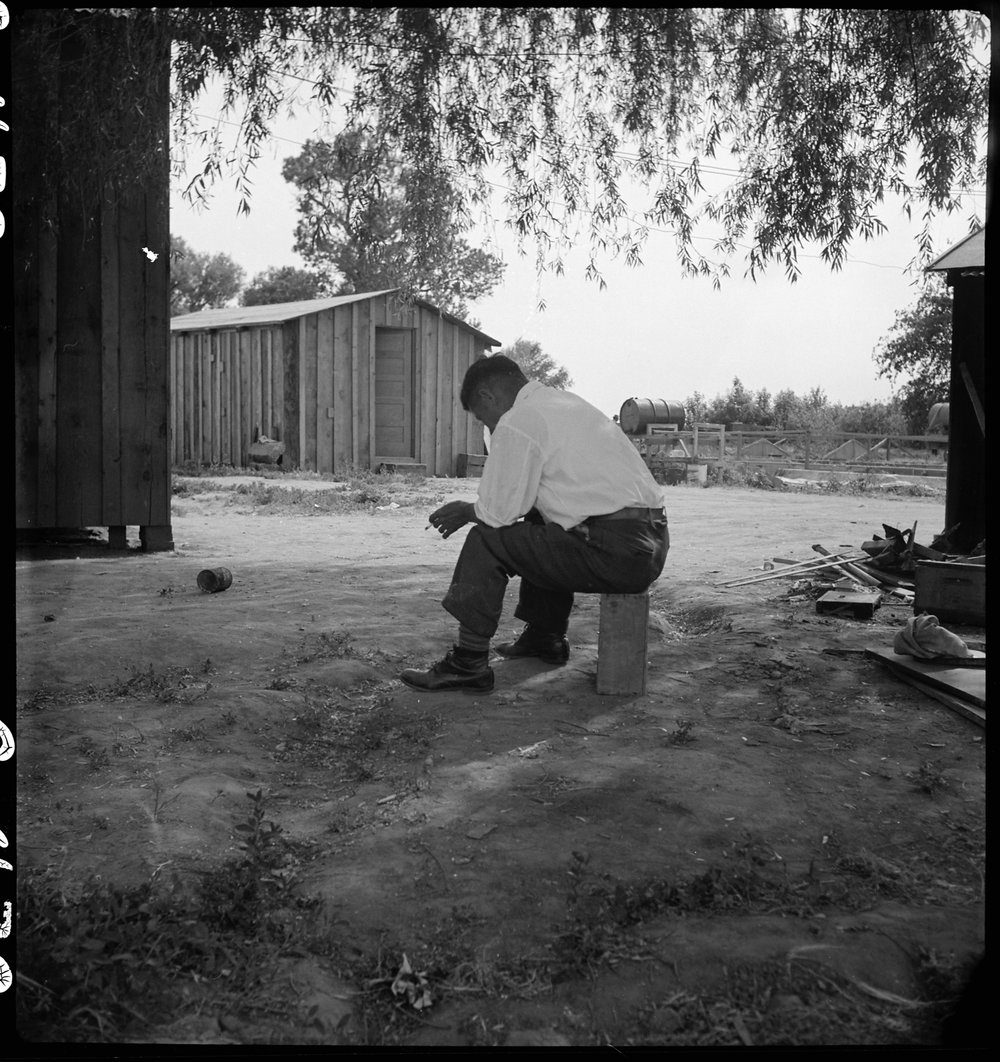 PRINT AVAILABLE May 20, 1942 — Woodland, California. Tenant farmer of Japanese ancestry who has just completed settlement of their affairs and everything is packed ready for evacuation on the following morning to an assembly center.