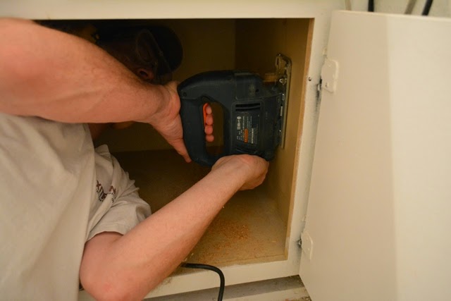 Using a jig-saw in a cabinet