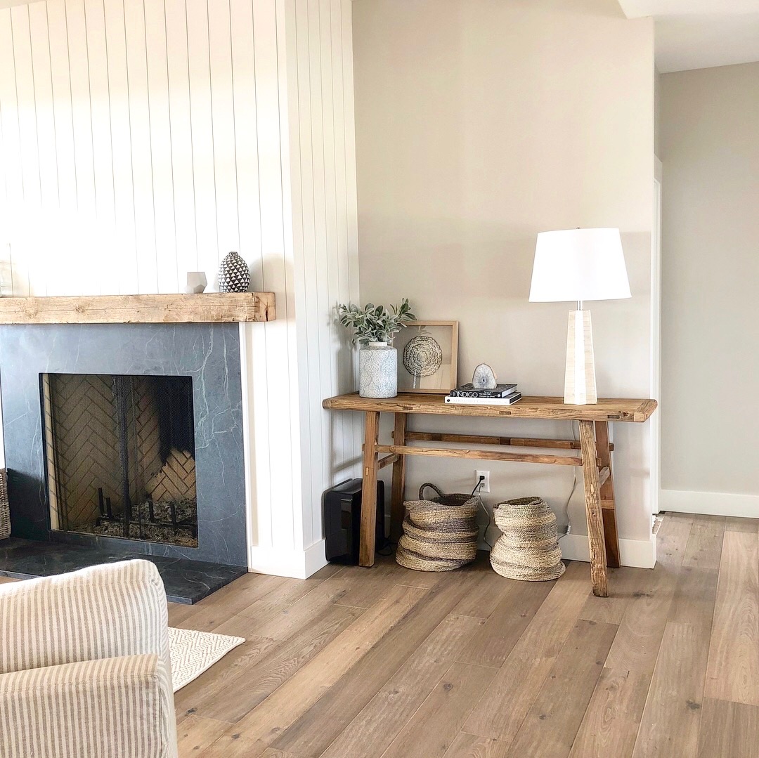 This client loves the "California" modern look -- we selected a reclaimed elm console table to balance the fireplace.&nbsp; Next step -- art! 
