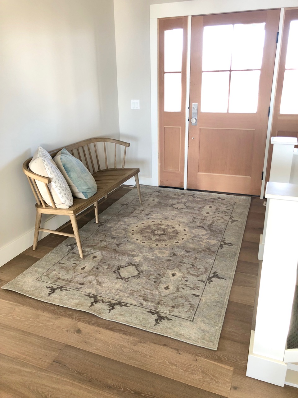  For the entry, a beautiful hand-knotted wool rug that is as durable as it is gorgeous!&nbsp; A bit of color without distracting from the natural beauty of the wood floors and trim. 