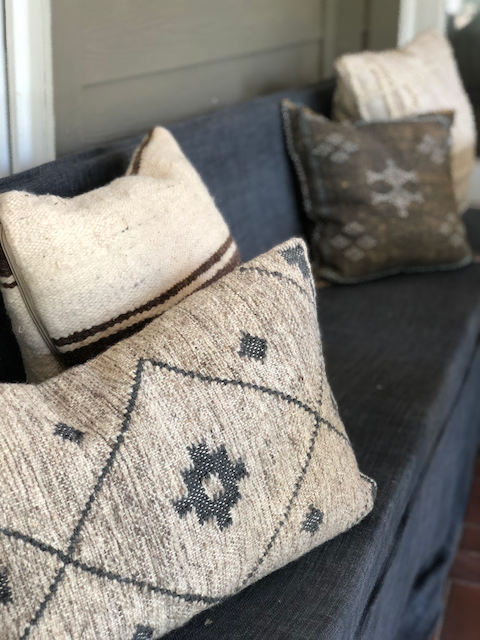 moroccan cactus silk sunroom wool pillows screened porch omaha nebraska amethyst home interior design linen slipcovered dining bench bistro tables