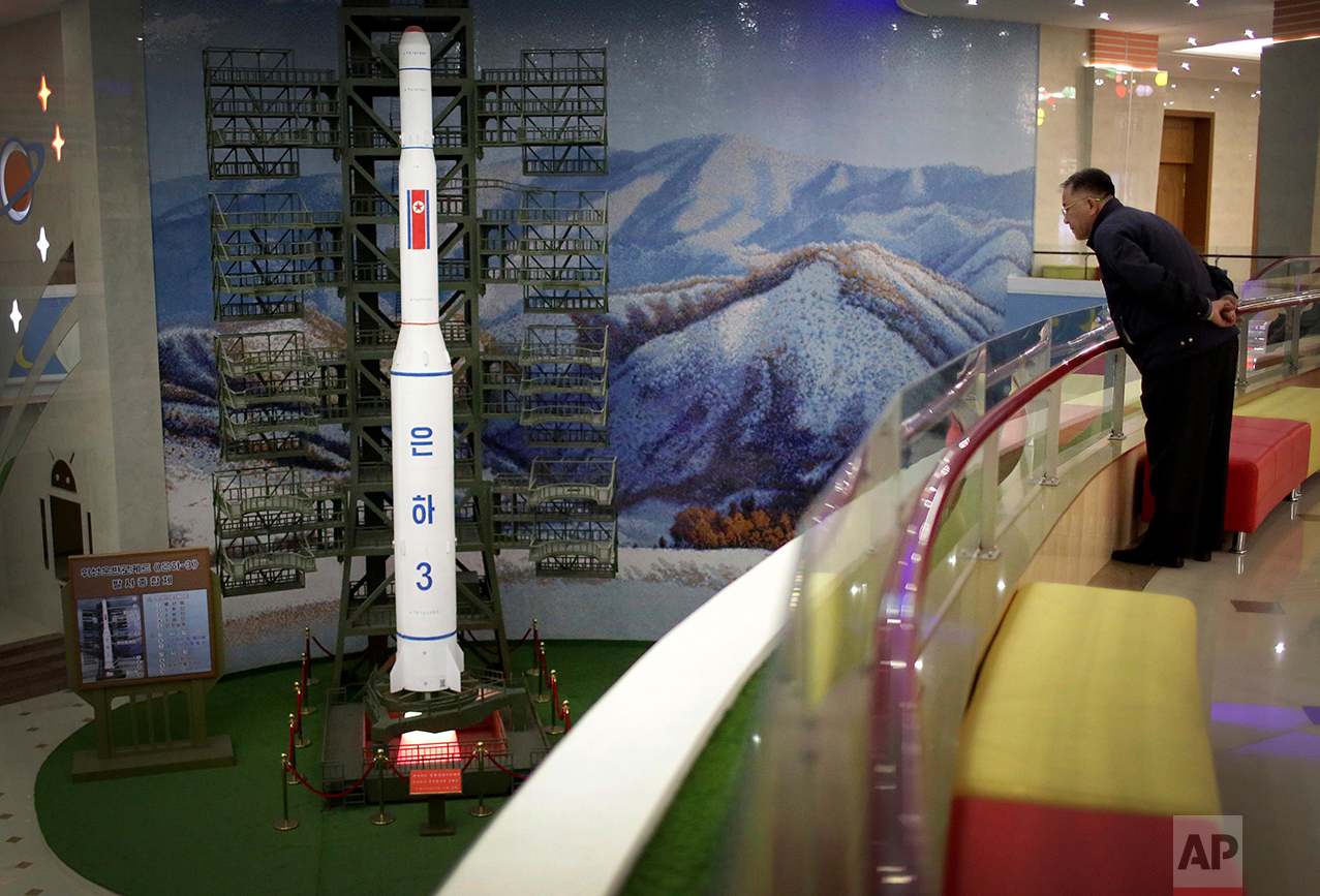 A North Korean man looks at a model of the Unha 3 space launch vehicle displayed at the Mangyongdae Children's Palace on Friday, April 14, 2017, in Pyongyang, North Korea. (AP Photo/Wong Maye-E)