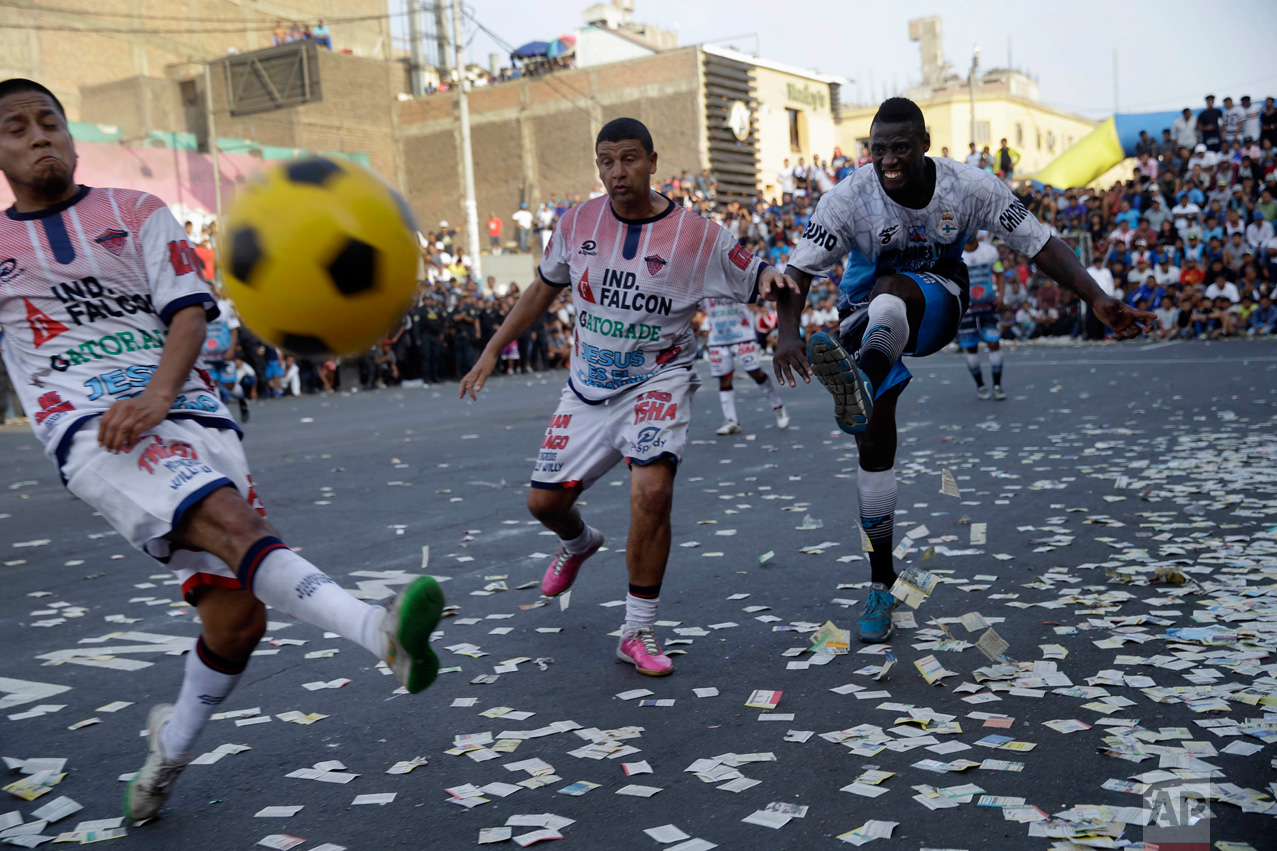  In this Monday, May 1, 2017 photo, teams "Purito Barrios Altos" and "Ají San Cosme" play the final game at the Little World Cup of Provenir street soccer championship in Lima, Peru. The tournament has been a big focus for Peruvian fans for a while, because the country’s national team hasn't qualified to play in international soccer’s World Cup since 1982. (AP Photo/Martin Mejia) 