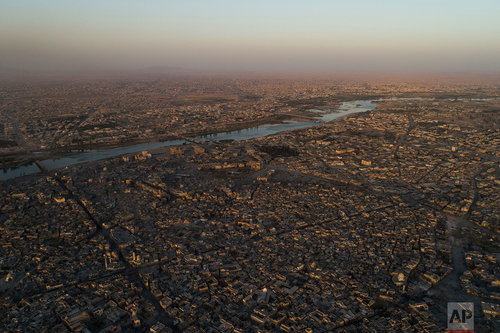 The Tigris river separates the east, top, and west side of Mosul during fighting between Iraqi security forces and Islamic State militants in Mosul, Iraq, Thursday, June 29, 2017. (AP Photo/Felipe Dana)