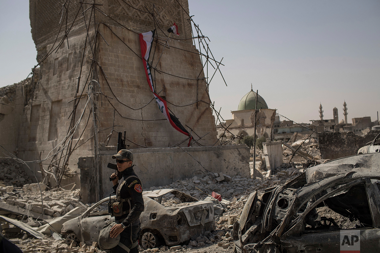 An Iraqi Special Forces soldier walks in the destroyed al-Nuri mosque complex as Iraqi forces continue their advance against Islamic State militants in the Old City of Mosul, Iraq, Sunday, July 2, 2017. (AP Photo/Felipe Dana)