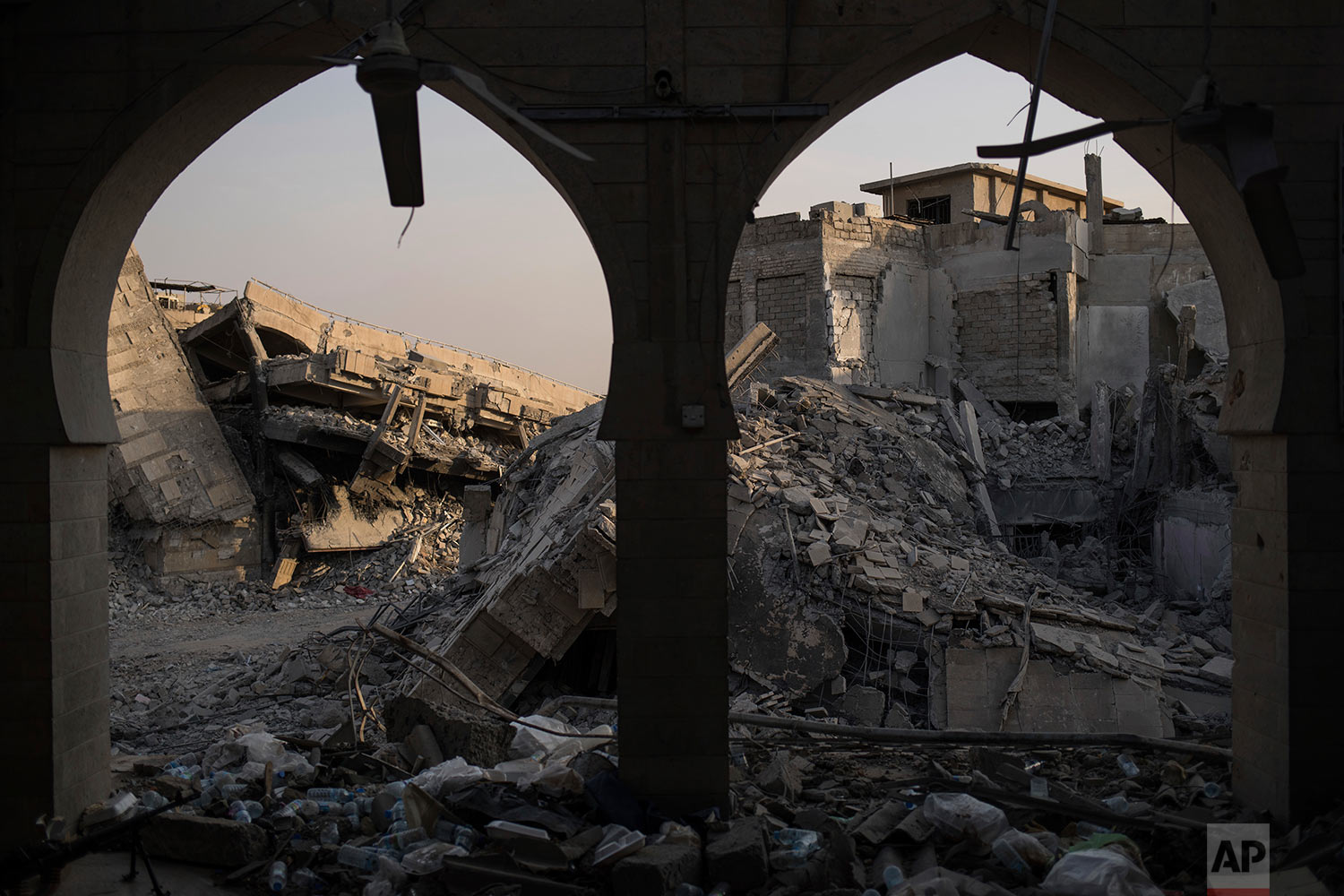 In this July 9, 2017 photo, destroyed buildings sit in the Old City of Mosul, Iraq. (AP Photo/Felipe Dana)