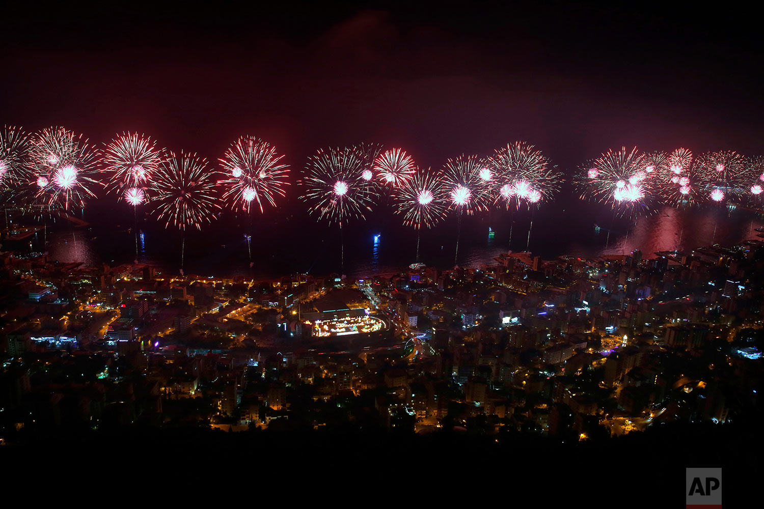 Fireworks explode over the coastal town of Jounieh, Lebanon, Saturday, July 15, 2017, during the city's international festival. The two-month annual festival includes concerts by local and international singers as well as plays and activities. (AP Photo/Bilal Hussein)