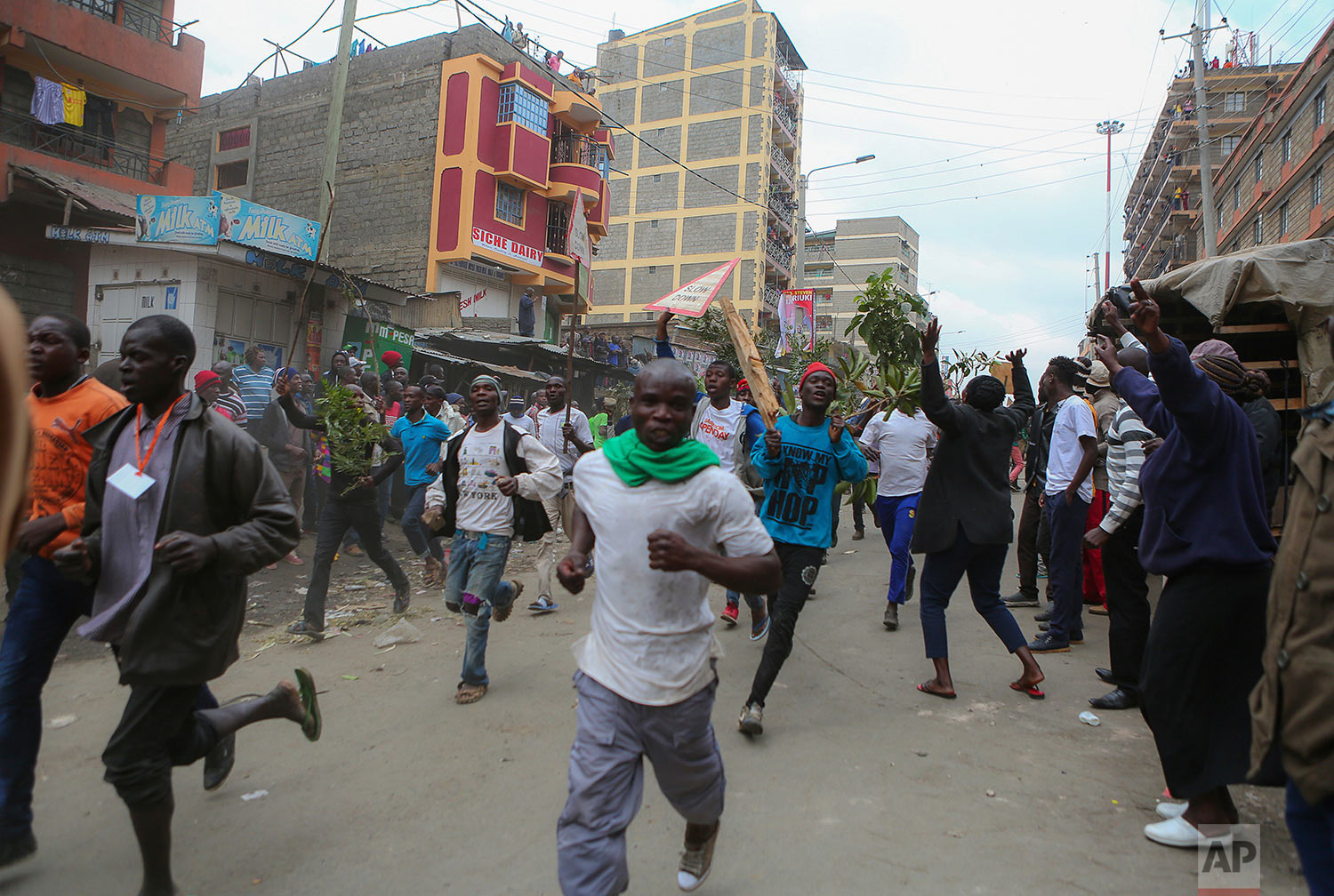  Residents of the Mathare area of Nairobi, Kenya, take to the streets by blocking roads with burning tyres to protest in support of Kenyan opposition leader and presidential candidate Raila Odinga, Wednesday, Aug. 9, 2017. Odinga alleges that hackers manipulated the Tuesday election results which appear to show President Uhuru Kenyatta has a wide lead over Odinga. (AP Photo. (AP Photo/Brian Inganga) 
