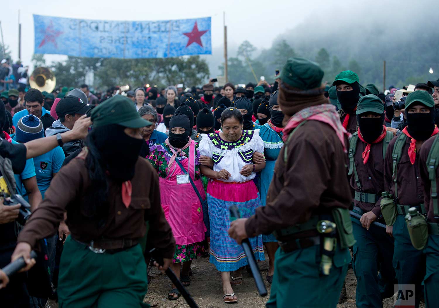  In this Sunday, Oct. 15, 2017 photo, presidential candidate for the National Indigenous Congress, Maria de Jesus Patricio, is escorted by Zapatistas at her campaign rally in the Zapatista stronghold of Morelia, in the southern state of Chiapas, Mexico. (AP Photo/Eduardo Verdugo) 