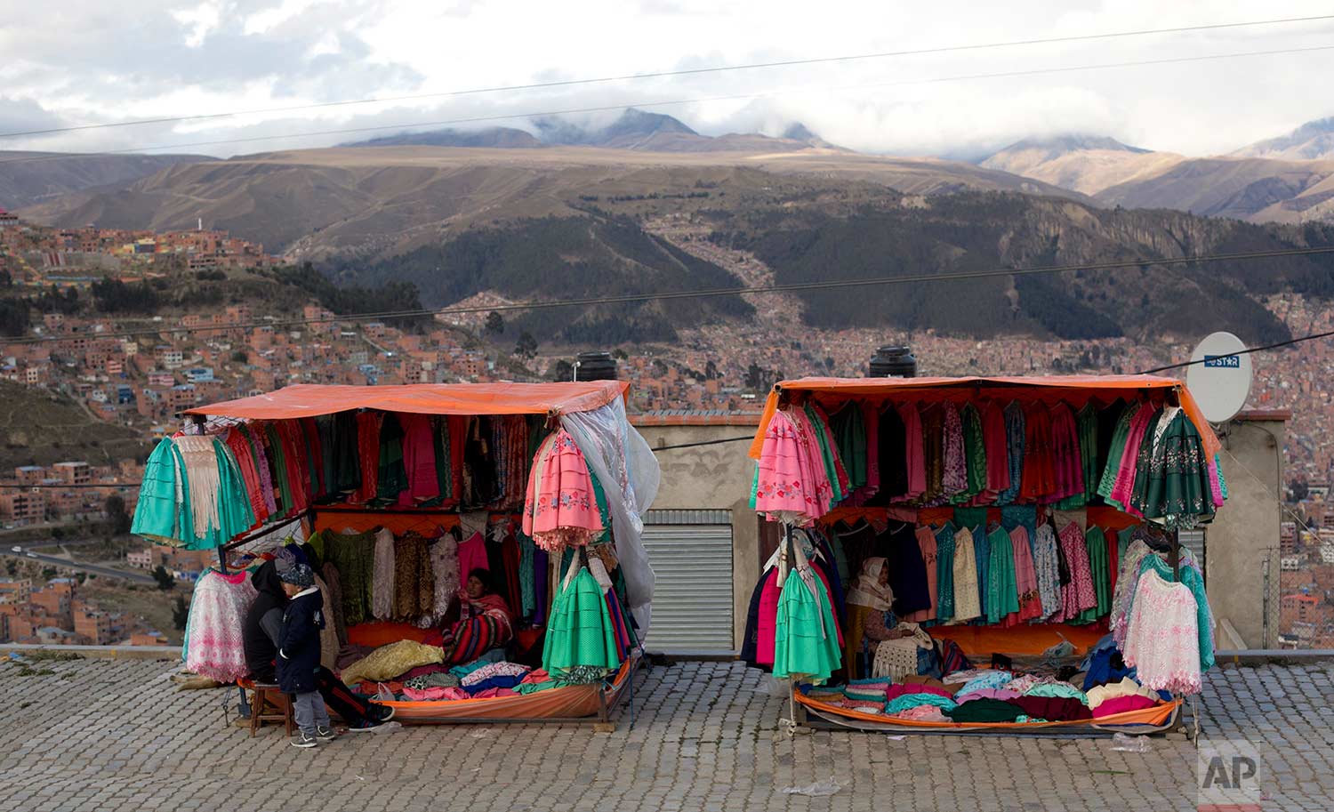  Traditional Andean women's skirts hang for sale at vendors' stores set up along the road between El Alto and La Paz, Bolivia, Thursday, Oct. 12, 2017. (AP Photo/Juan Karita) 