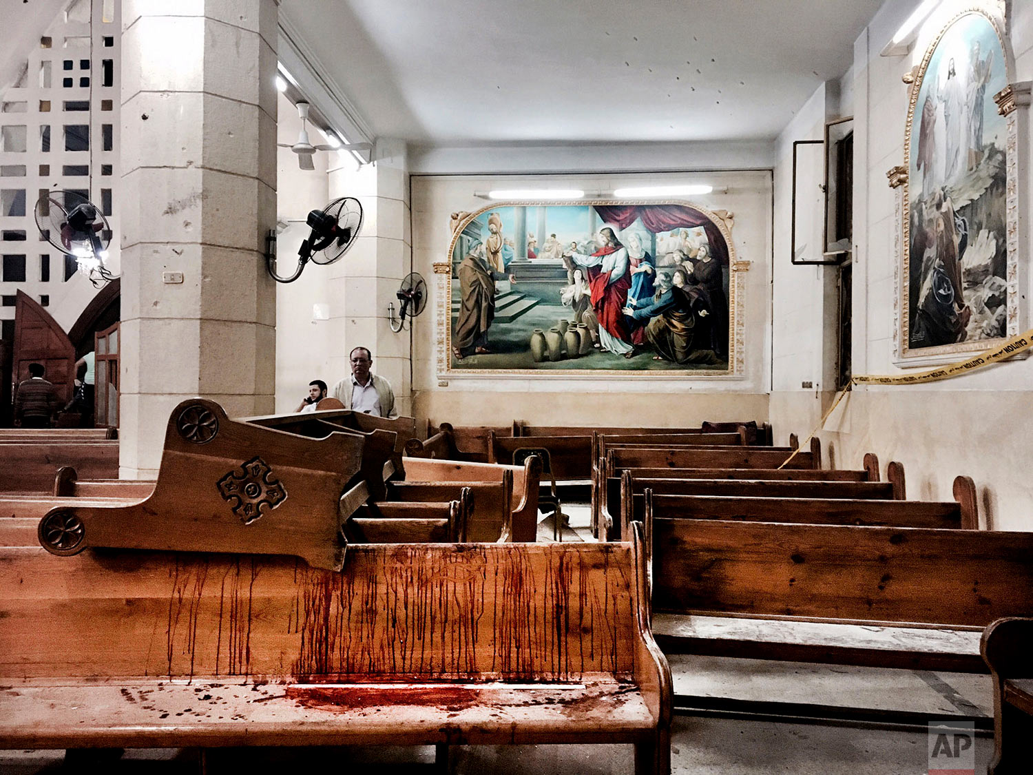  Blood stains pews inside the St. George Church after a suicide bombing, in the Nile Delta town of Tanta, Egypt, Sunday, April 9, 2017. Bombs exploded at two Coptic churches in the northern Egyptian cities of Tanta and Alexandria as worshippers were celebrating Palm Sunday, killing over 40 people and wounding scores more in assaults claimed by the Islamic State group. (AP Photo/Nariman El-Mofty) 