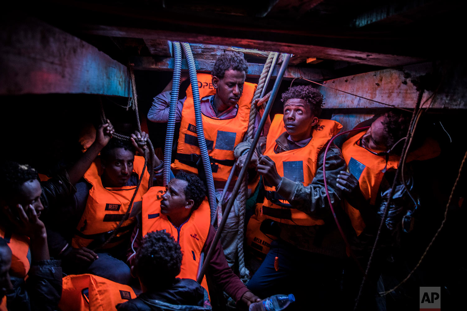  In this Tuesday, Jan. 16, 2018 photo Sub-Saharan refugees and migrants, mostly from Eritrea, wait to be rescued by aid workers of Spanish NGO Proactiva Open Arms, in the lower deck of a wooden as they were trying to leave the Libyan coast and reach European soil, 34 miles north of Kasr-El-Karabulli, Libya. (AP Photo/Santi Palacios)&nbsp; |&nbsp; See these photos on AP Images  