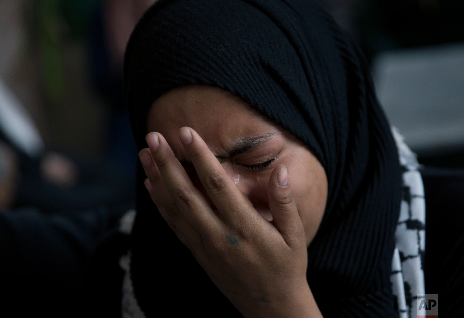  A woman weeps during the funeral of Palestinian Yasin Saradeeh, 33, who was killed by Israeli soldiers during an army raid in Jericho on February 22, 2018, in the West Bank city of Jericho, Thursday, March 29, 2018. (AP Photo/Nasser Nasser) 