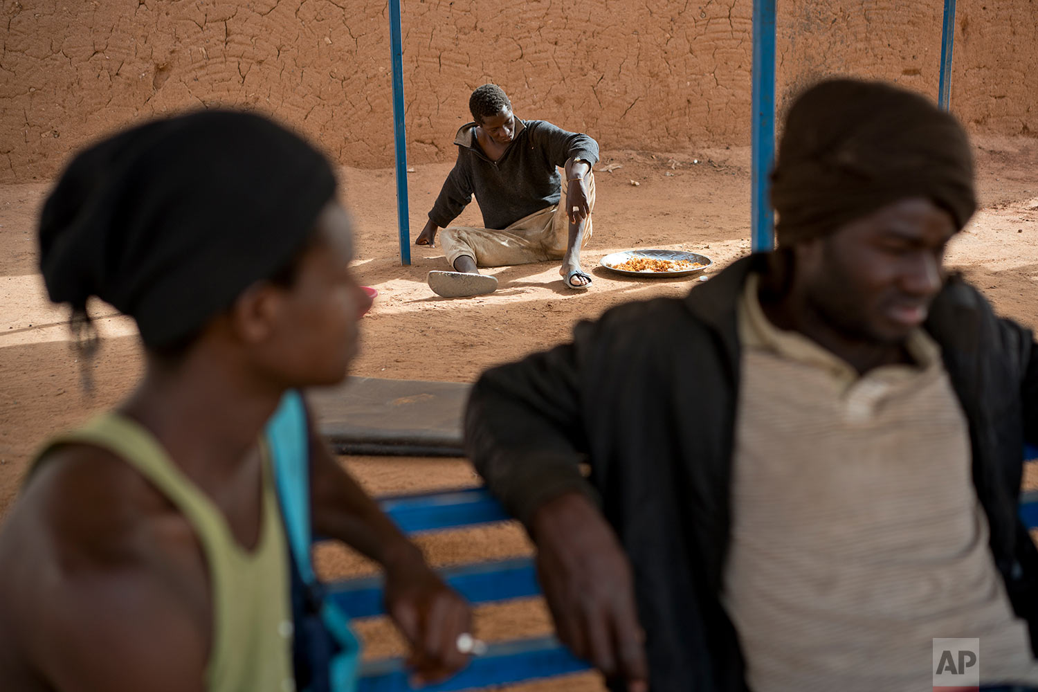  A young migrant who has been expelled from Algeria sits in a transit center in Arlit, Niger, on June 1,2018. (AP Photo/Jerome Delay) 