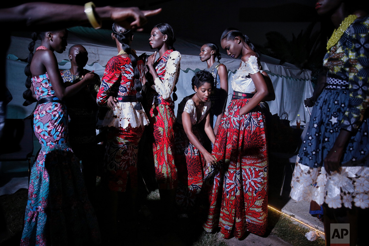 Models wait backstage during Dakar Fashion Week in the Senegalese capital, Saturday July 1, 2017. (AP Photo/Finbarr O'Reilly)