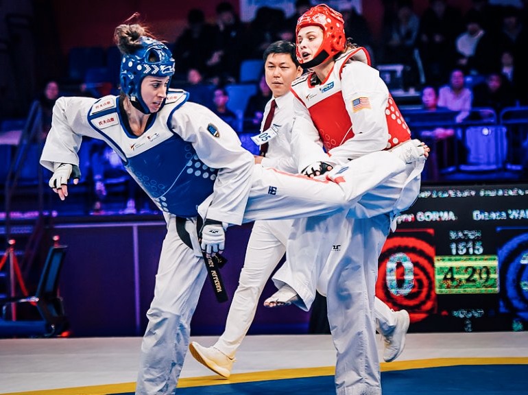 Team GB's Bianca Walkden (left) goes for a spinning back kick on her way to winning the gold medal and $70,000 in prize money at the World Taekwondo Grand Slam in Wuxi, China. Img: World Taekwondo