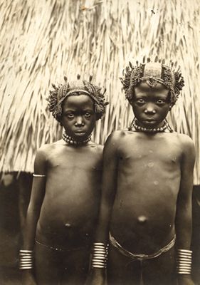 Two young boys in native head dress. West Africa, circa 1900-1920.