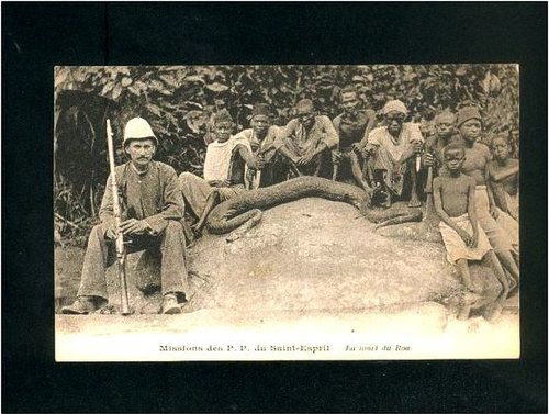 A python, a French missionary and locals in Gabon.