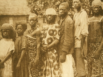 Photo of a family taken by missionaries of Saint-Coeur at the Coquilhatville mission, Belgian Congo.