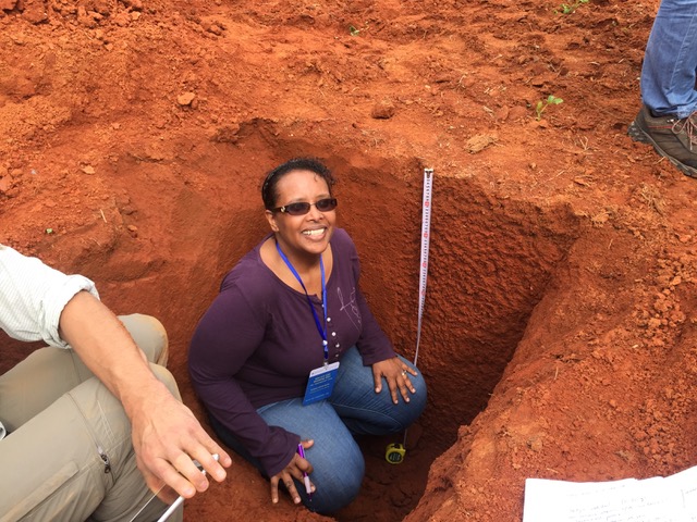 Asmeret inspecting soil profile.jpeg