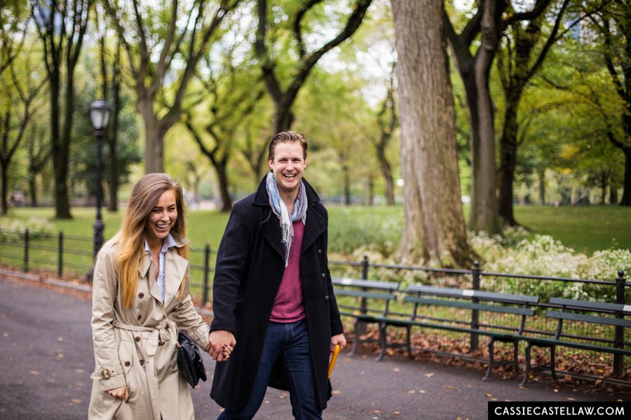 Laughing, happy couple walking down The Mall, Lifestyle Engagement Session in the fall Central Park NYC - www.cassiecastellaw.com