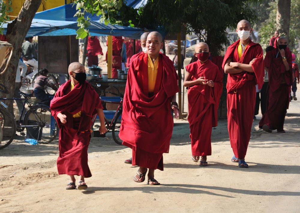 Tibetans walking the streets in Bodhgaya.JPG