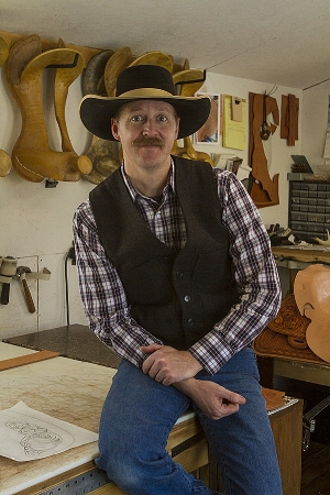This portrait of Justin Thorson, saddle maker, is flat without flash. 