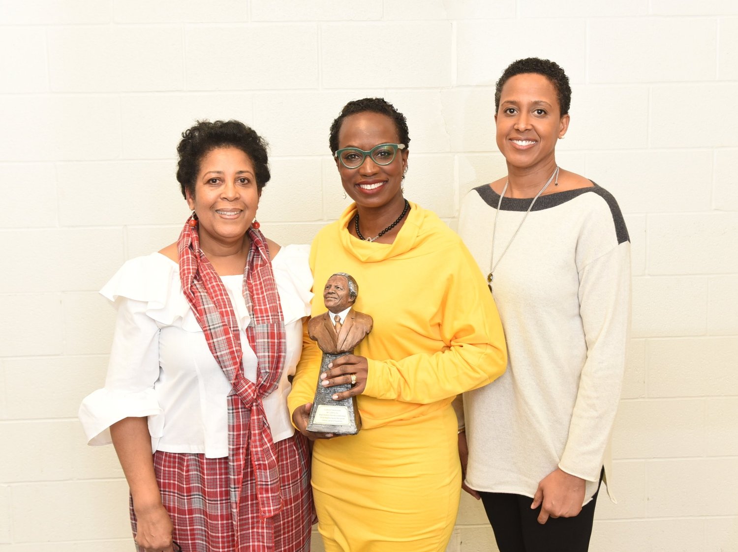 Esther Forde (l) and Durham Black Educators Network chair Eleanor McIntosh presented the Madiba Award to Celina Caesar-Chavannes