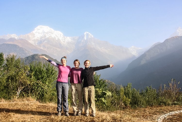 Euphoria in Ghandruk. A dry open grass field with a 270 degree view of the sun rising onto the distant Himalayas.