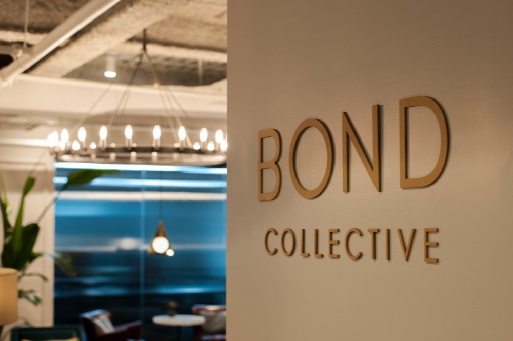 reception area and wall with Bond Collective sign welcoming visitors