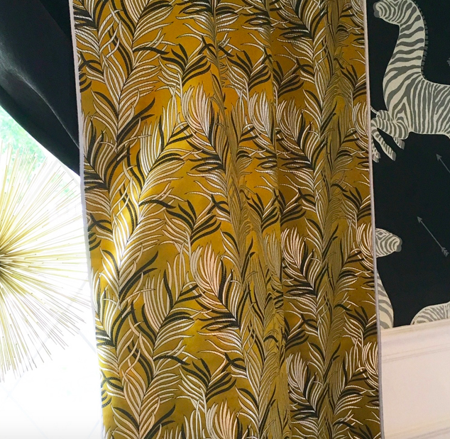I loved the texture of the metal starburst, chartreuse brocade with metallic print curtains and the wallpaper with metallic finishes in the zebra's stripes