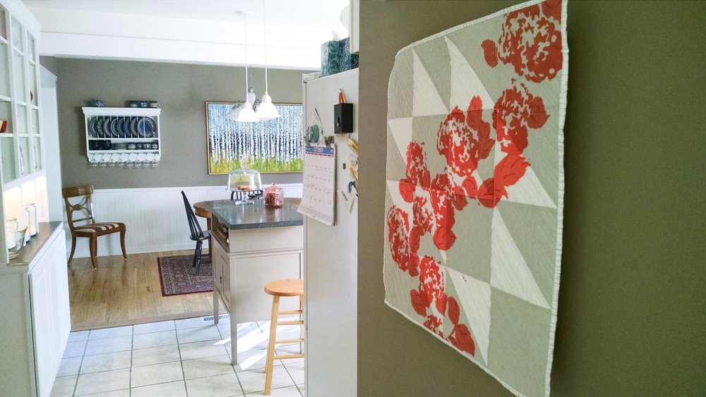 New Growth coral modern printed wall quilt living in its Ann Arbor home | by Lovely and Enough