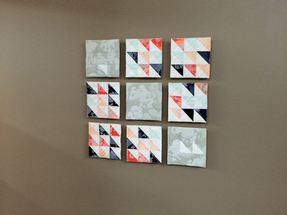 Remnants of Summer printed modern wall quilt living in its Wheaton College home | by Lovely and Enough