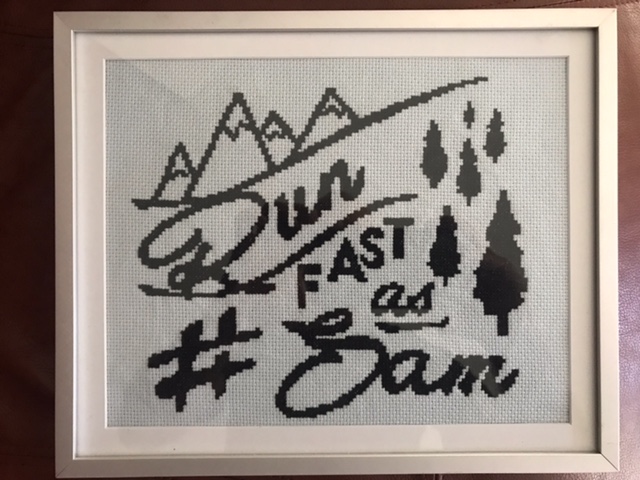A needlepoint made by one of Sam's November Project mates, gifted to Richard Dweck