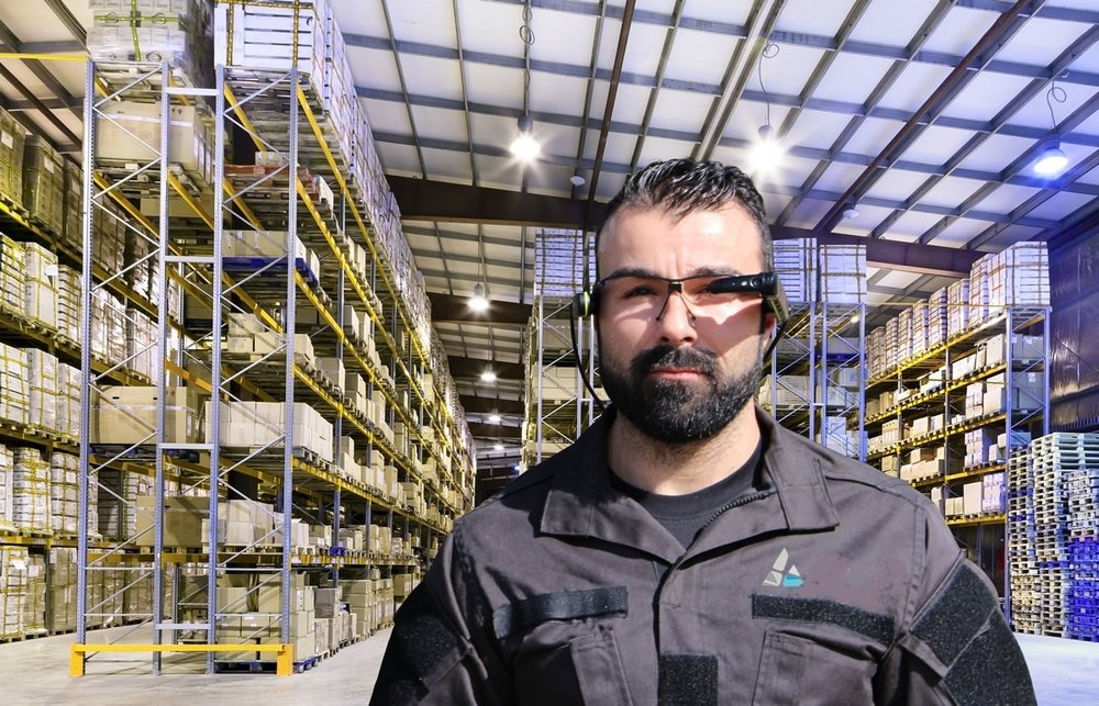 A warehouse worker using an augmented reality wearable device.
