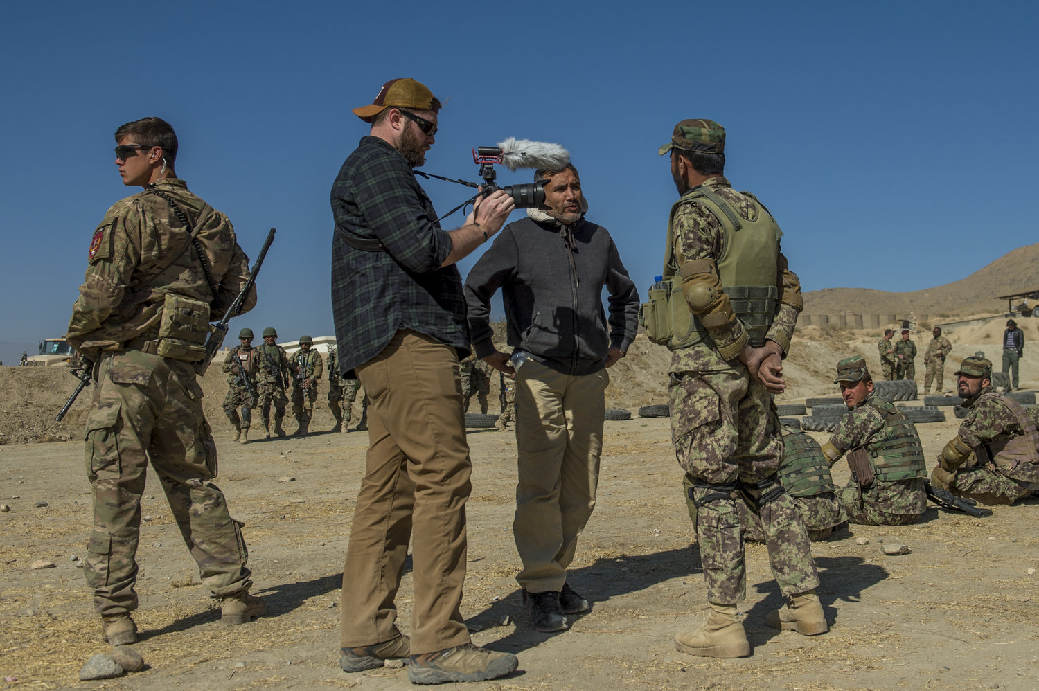  Interviewing the subject of one of my articles at Camp Commando just outside of Kabul. Off to the left of me was a U.S. soldier, known as a 'guardian angel', which was my primary means of protection while embedded.&nbsp; 