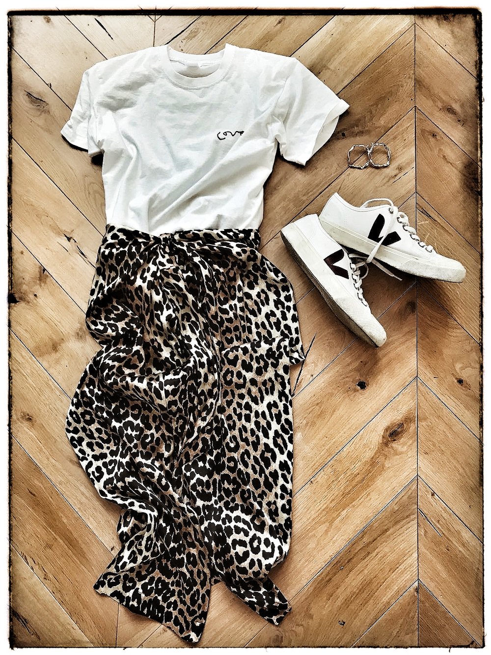  T-Short from  Meylor Goods , Skirt from  Ganni  and trainers from  Veja  