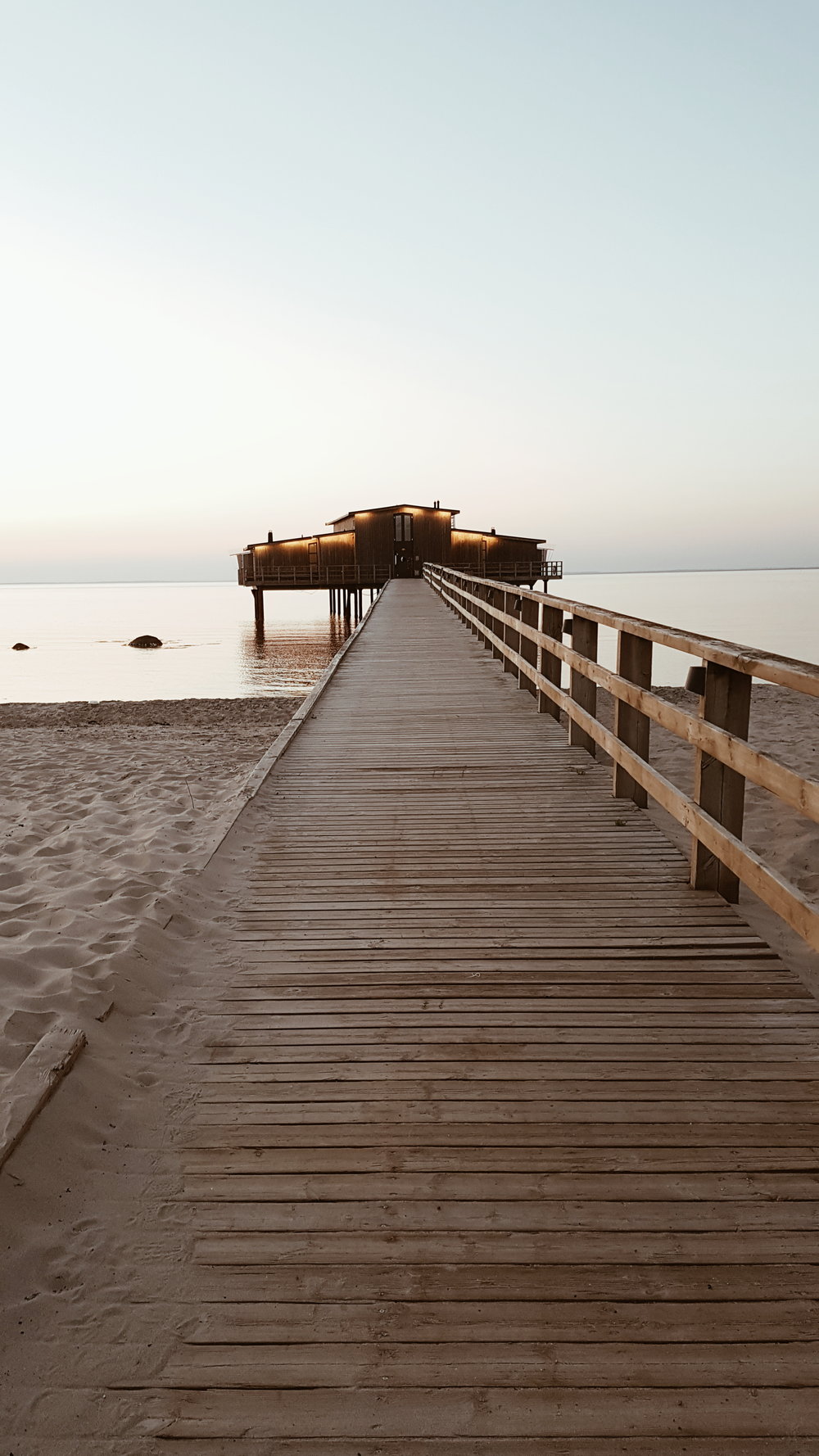  The stunning beach that Hotel Skansen overlooks and the sauna at the end of the pier for use by hotel residents 