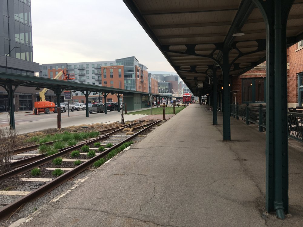 The historic train passenger platform canopy and rail landscaping in the West Haymarket 