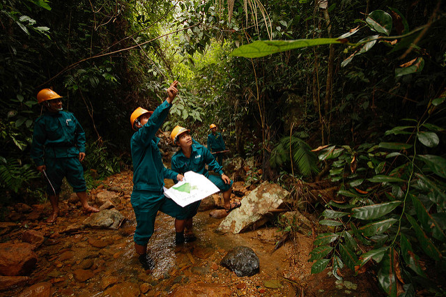 Patrollers working in the jungles around Macooih, Vietnam. Each patrol group is composed of community members who are tasked with maintaining the general well-being of the forest. This is made possible through the Poverty and Environment Fund with the approach known as payment for forest ecosystem services. Photo by: Asian Development Bank. 