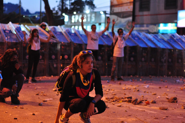 Protesters in front of police line in Caracas, Venezuela. Photo by: andresAzp