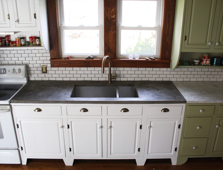 Concrete counters introduce texture and a consistent color to this kitchen.