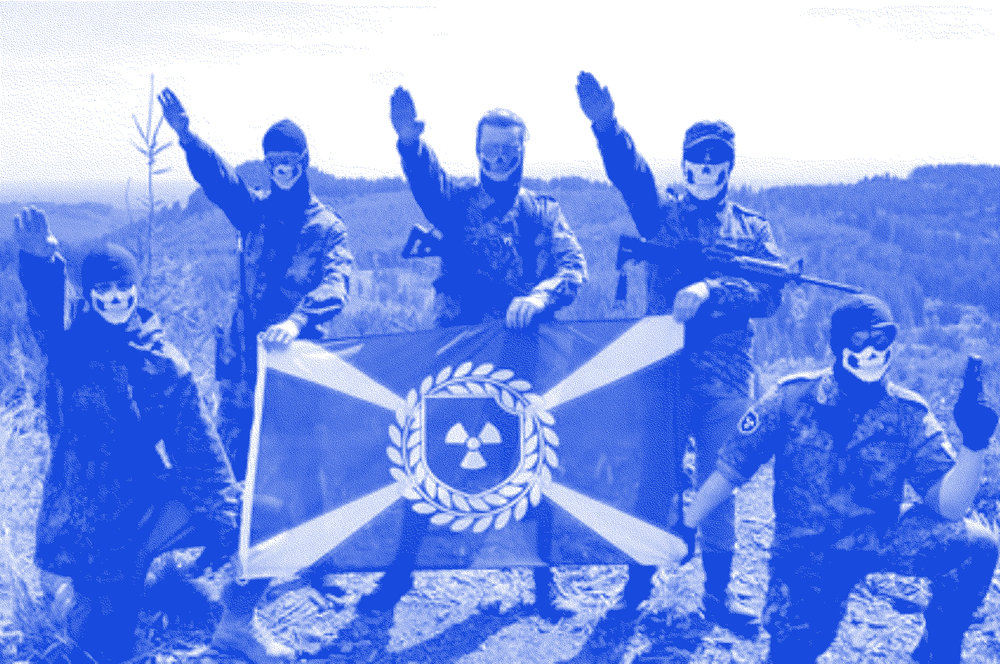 Members of  Atomwaffen  throw sieg heil salutes, while posing with their weapons and flag.