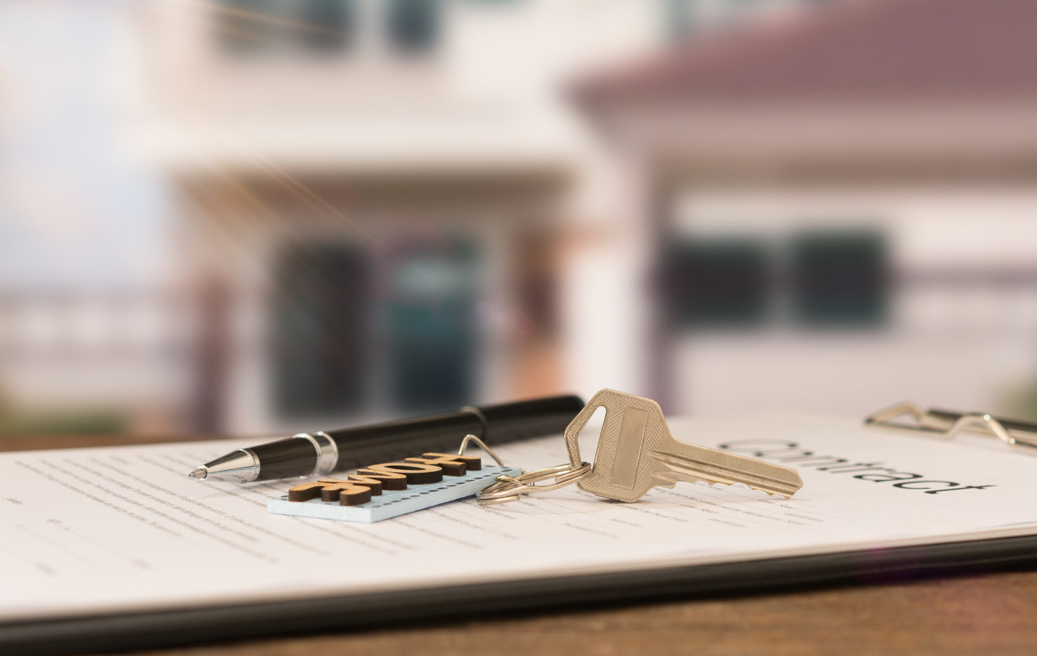 House keys on real estate contract ready to be signed