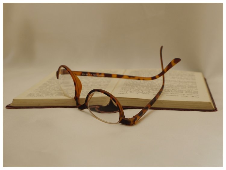 plastic framed half-eye reading glasses in tortoiseshell effect.