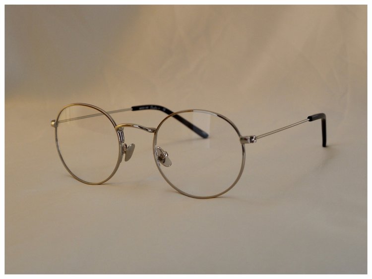 pair of silver coloured reading glasses in a classic design