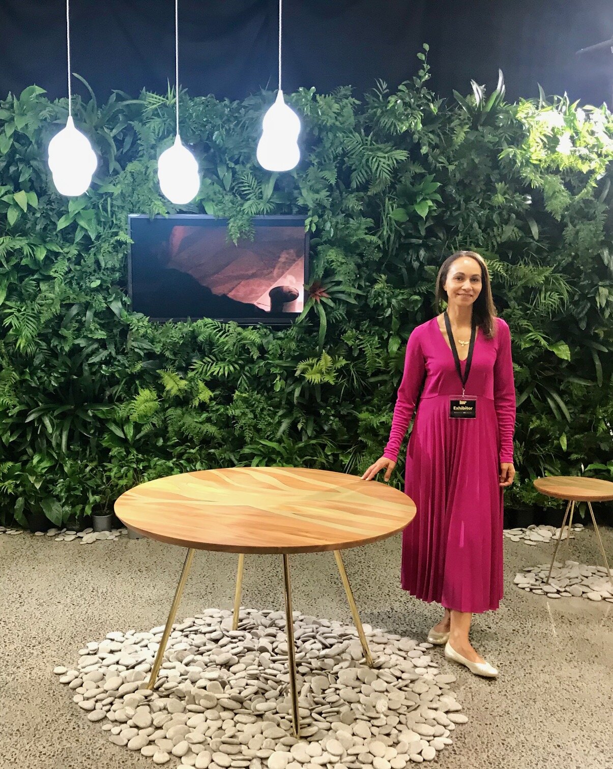 Creative director and founder, Lyzadie Renault, by the FLOW Round Dining Table.