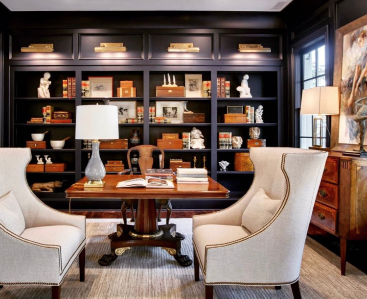 Navy library/office in the Southern Living Showcase Home by   Hatcliff Construction